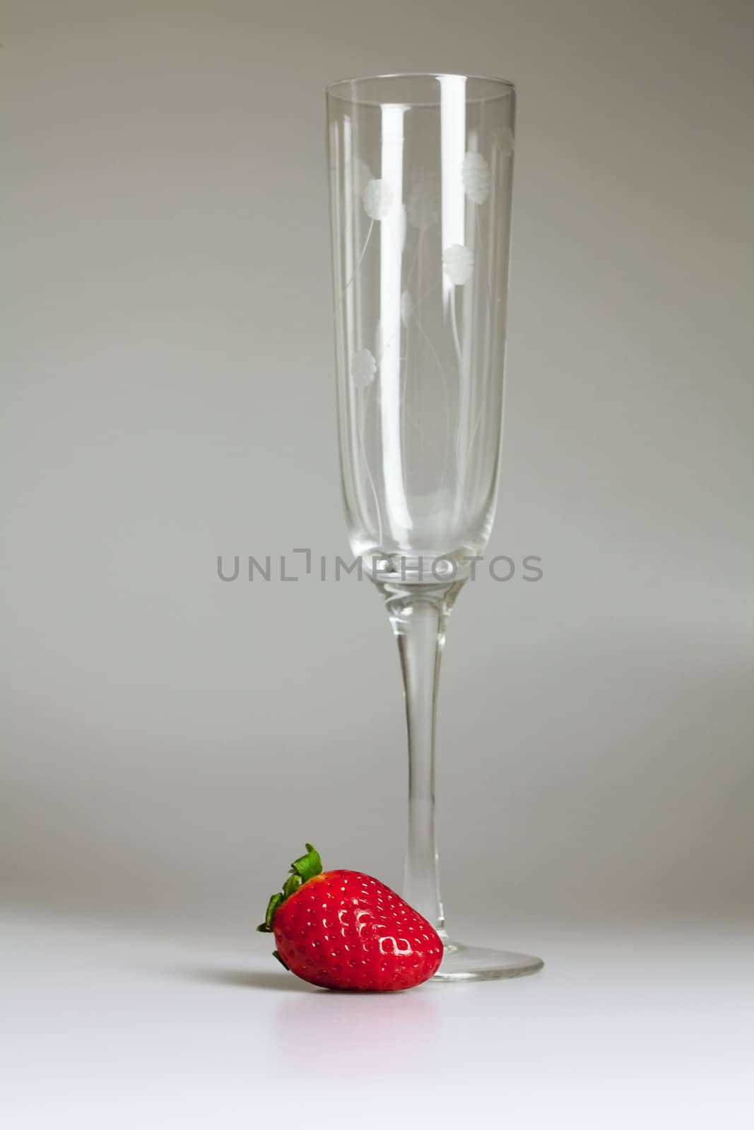  a glass and juicy strawberries