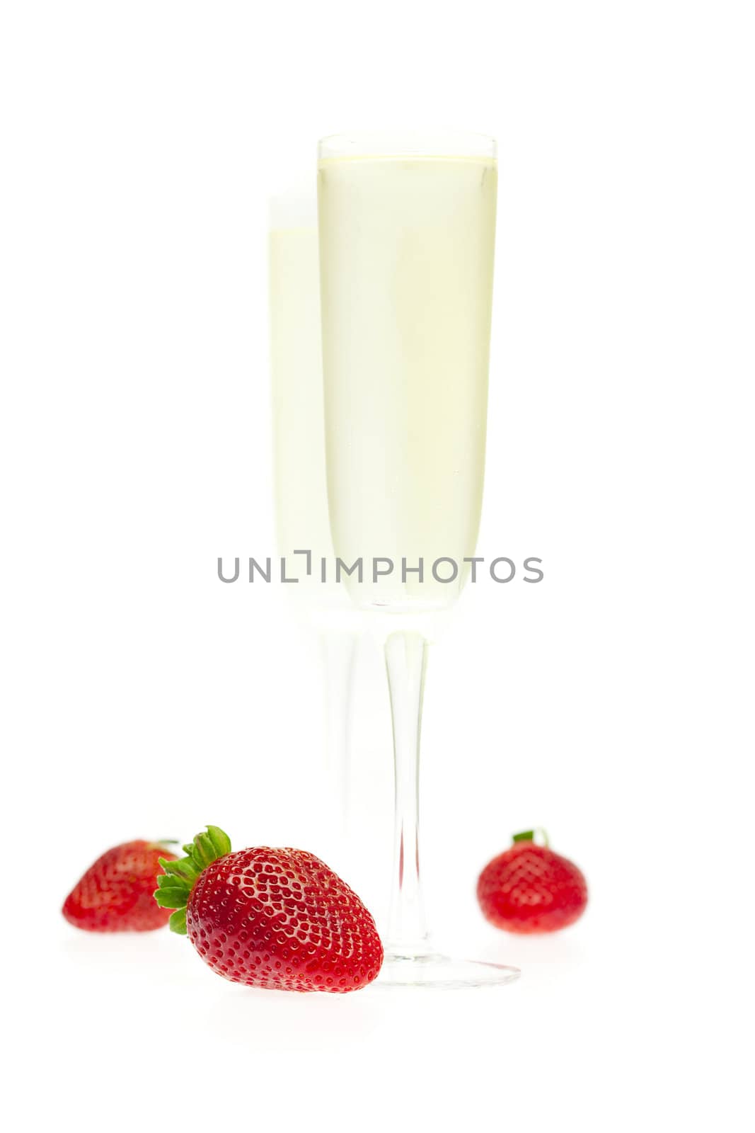 a glass of champagne and strawberries