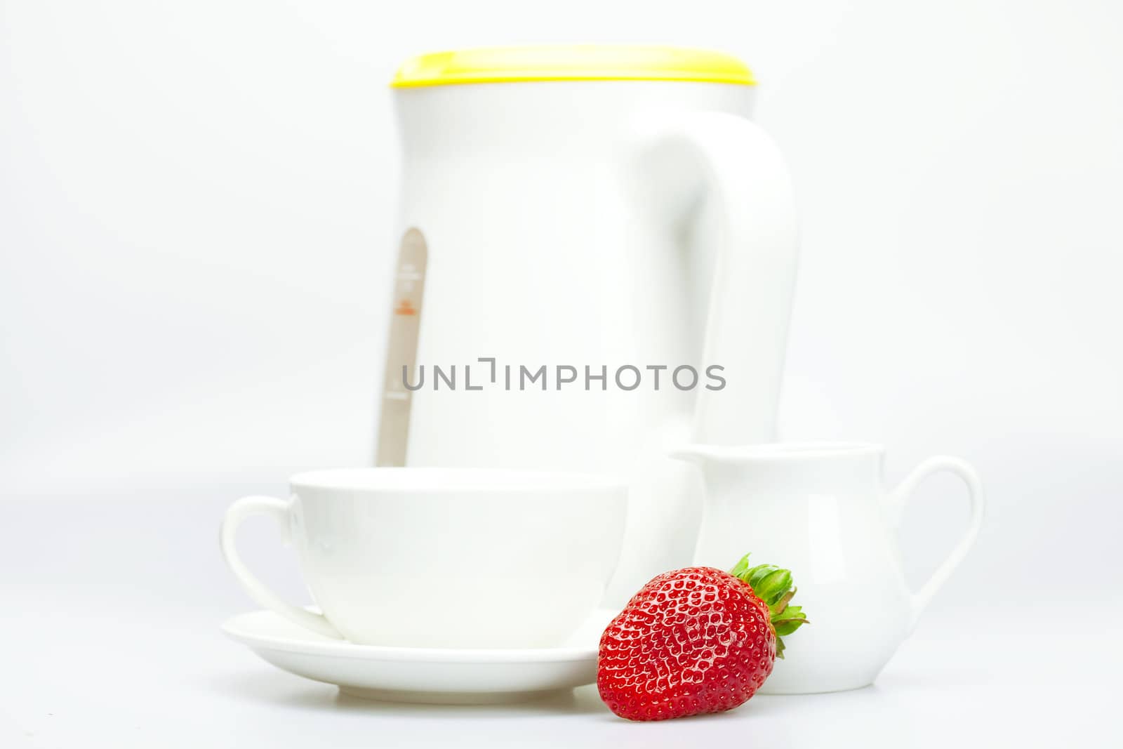 strawberry, white cup and teapot isolated on white by jannyjus