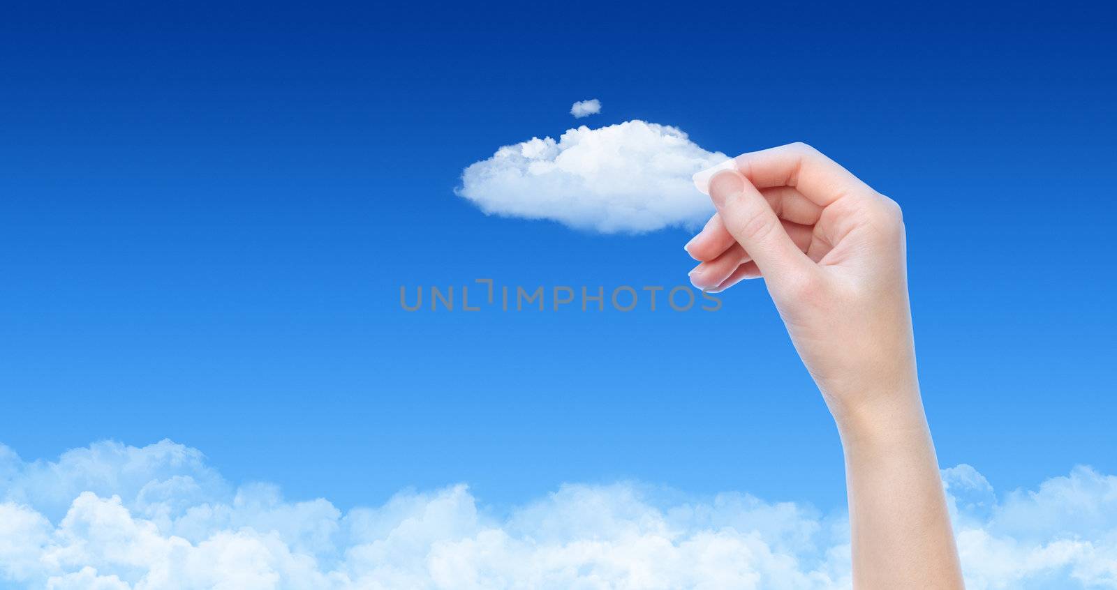 Woman hand hold the cloud against blue sky with clouds. Concept image on cloud computing and eco theme with copy space.