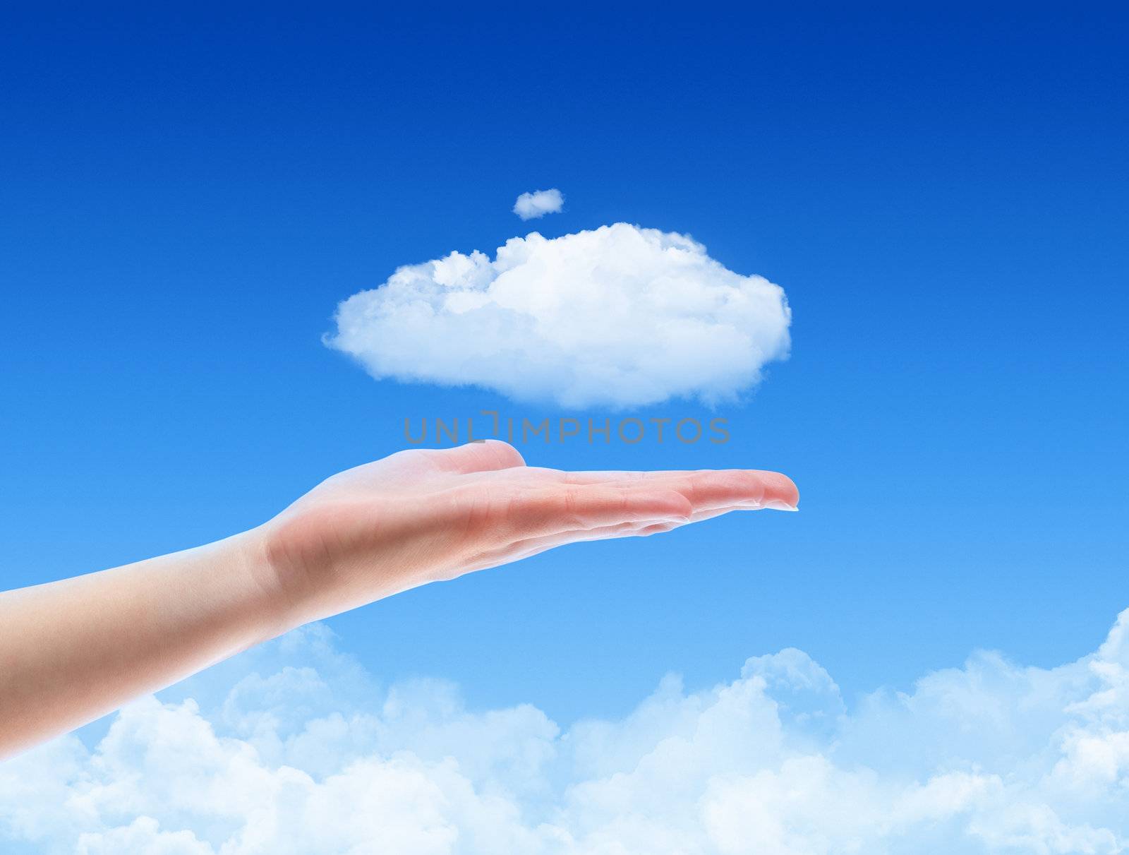 Woman hand offer the cloud against blue sky with clouds. Concept image on cloud computing and ecology theme.