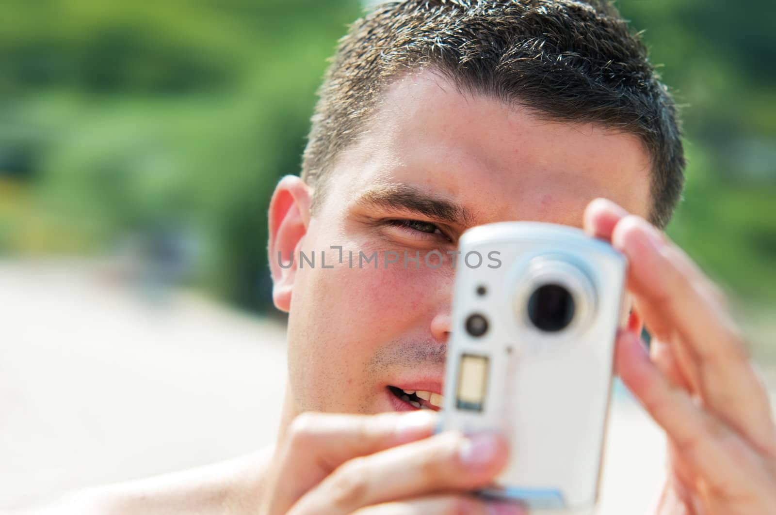 Man taking picture on holidays by photocreo