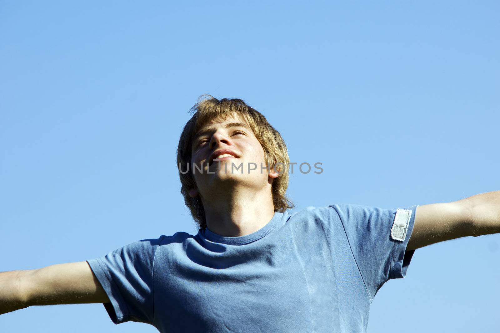 In tune with nature. Young boy showing happiness