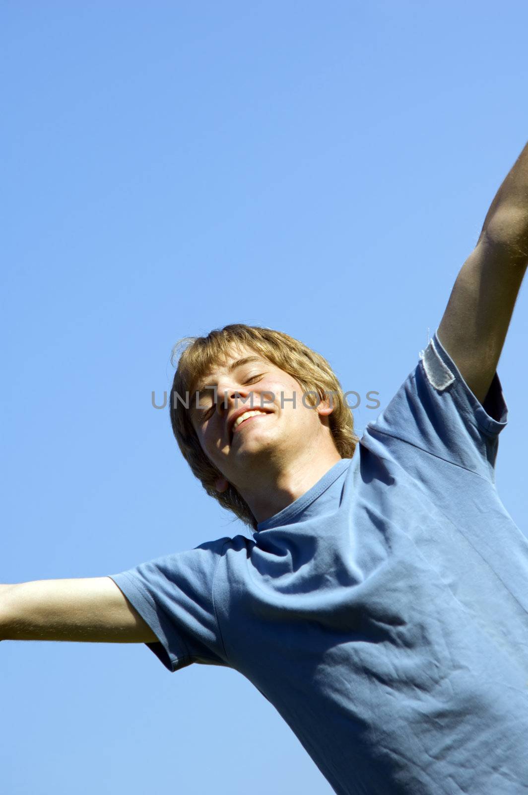 In tune with nature. Young boy showing happiness