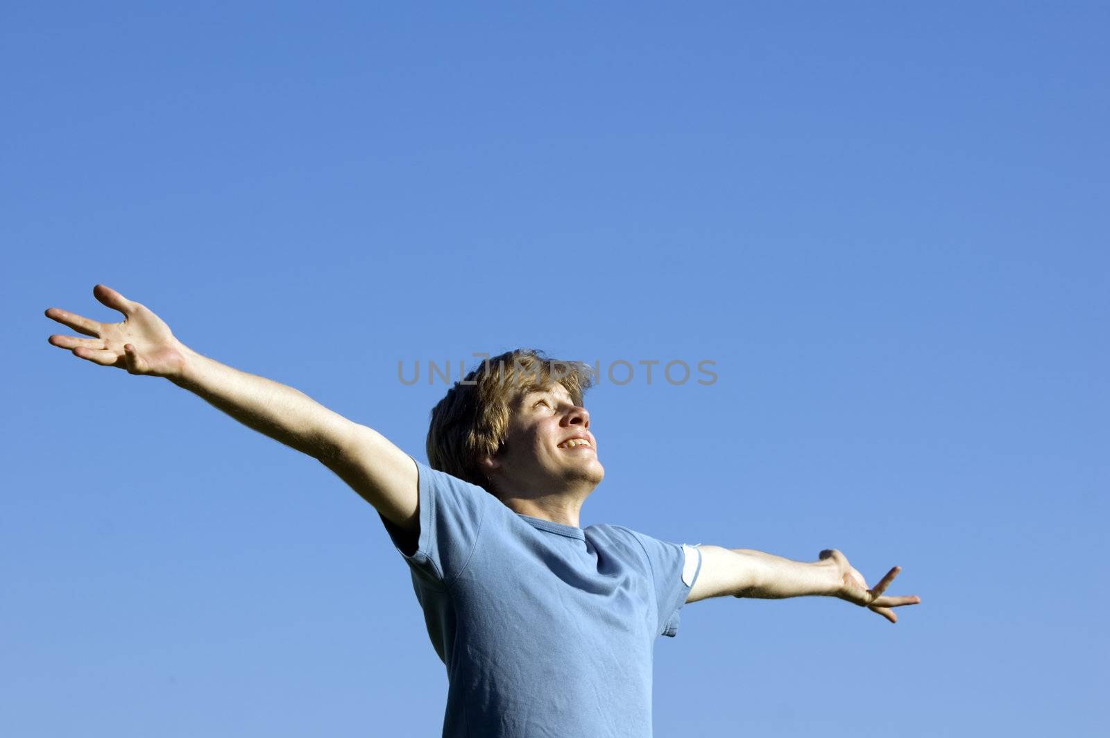 In tune with nature. Young boy showing happiness