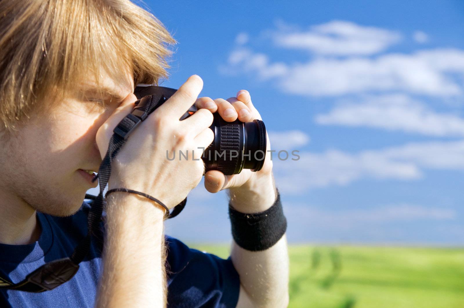 Photographer taking pictures outdoors
