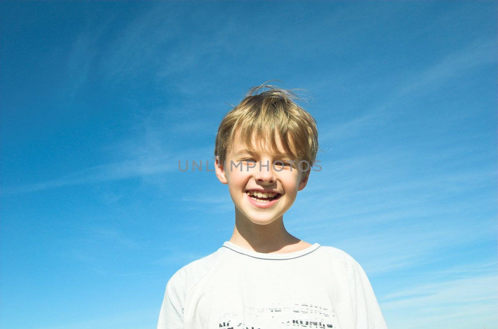 Happy boy on sky background