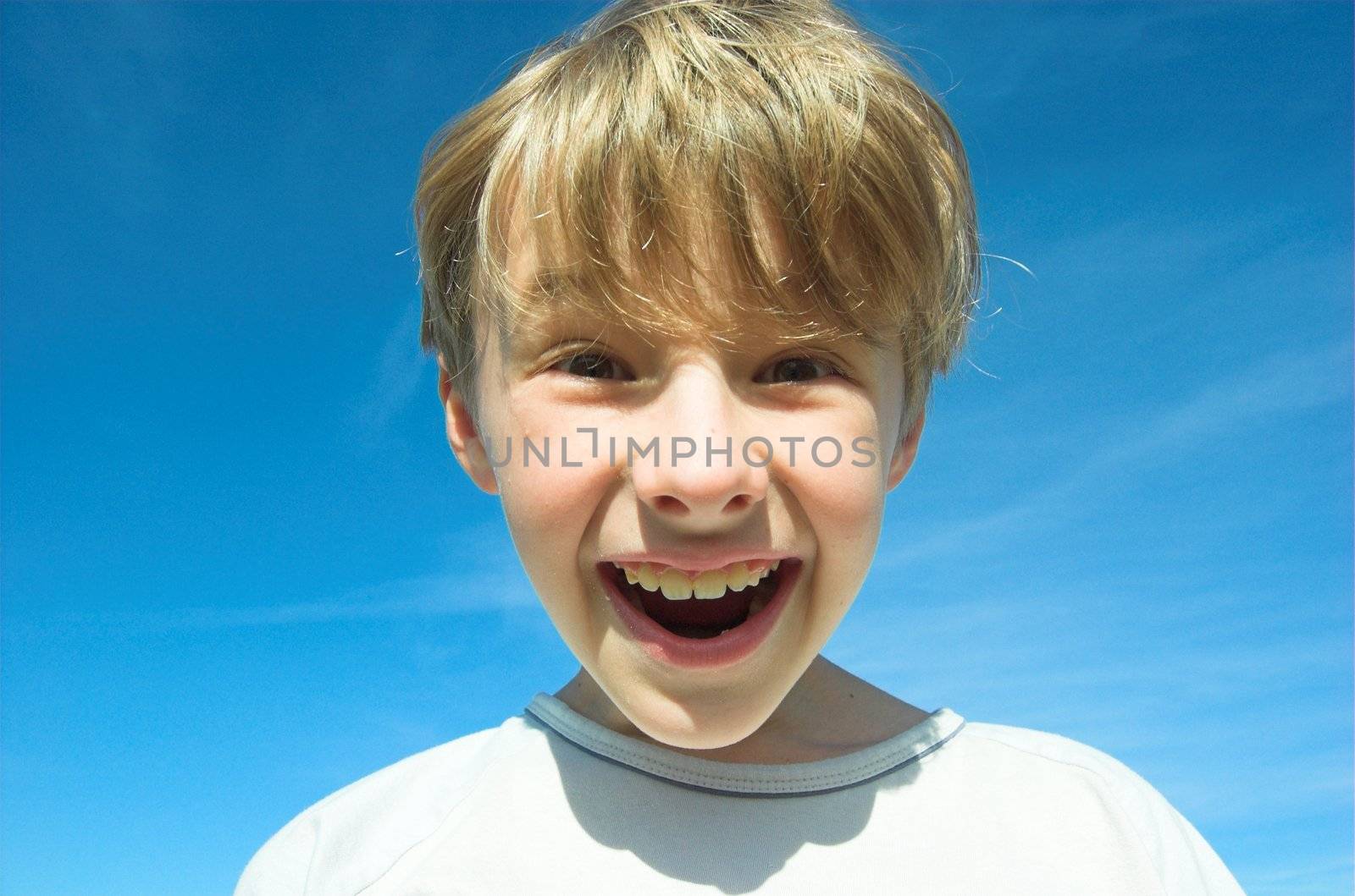 Happy boy on sky background