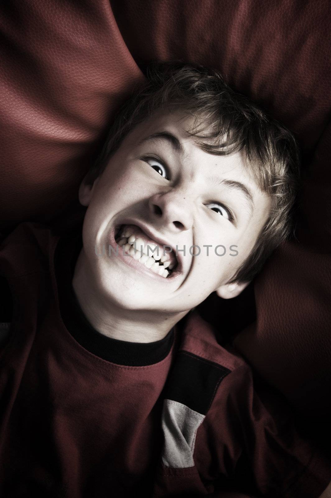 Angry boy portrait by photocreo