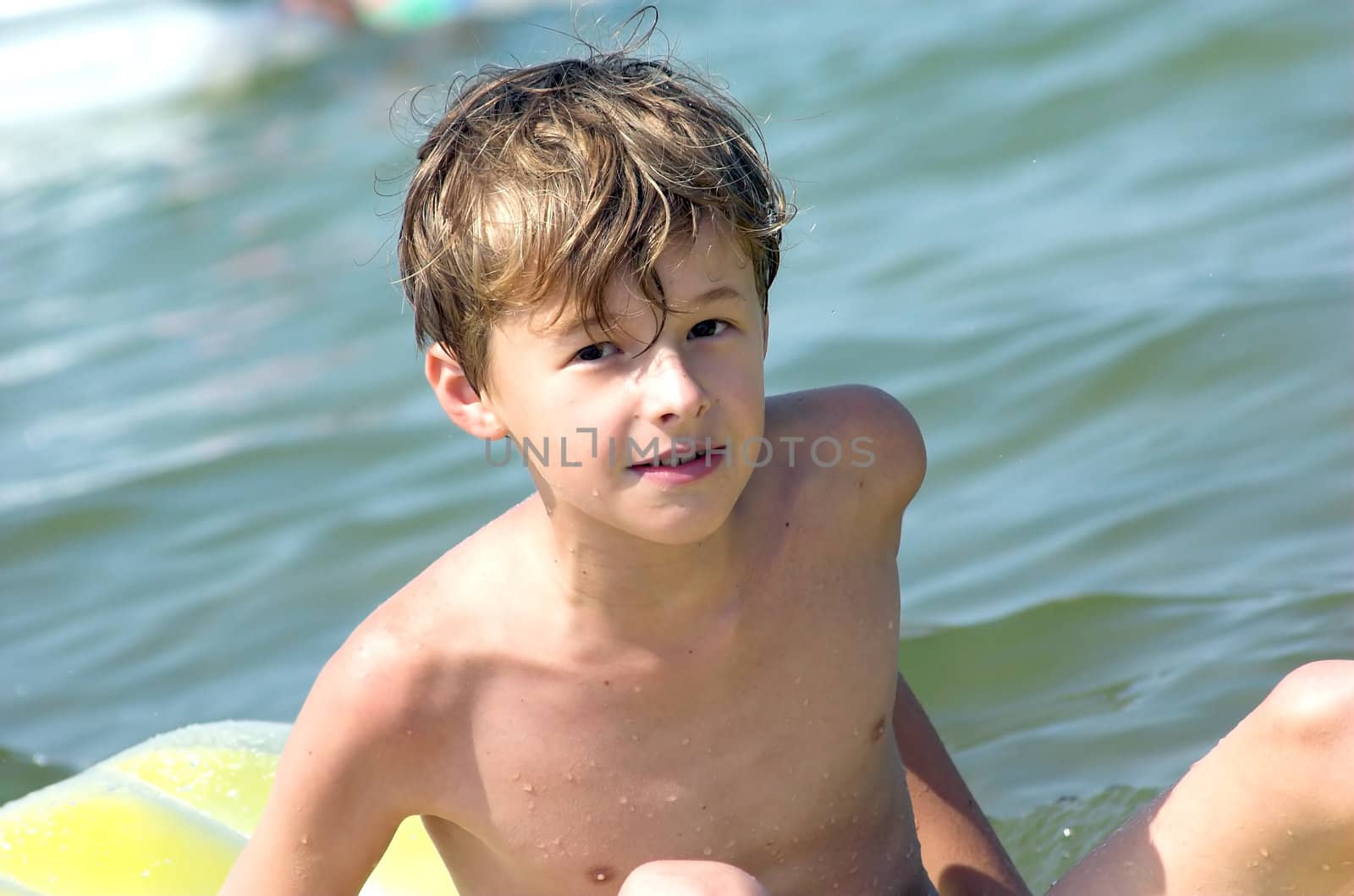 Young boy playing in the sea