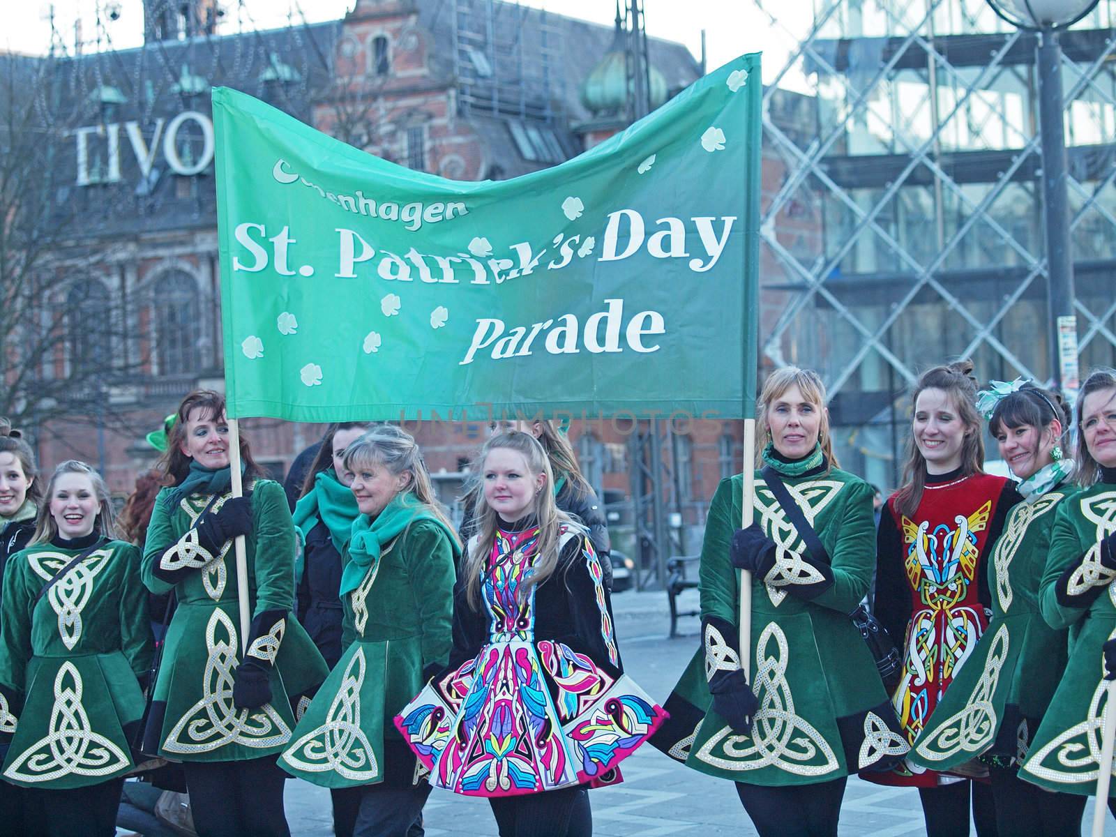 COPENHAGEN - MAR 17: Participants wearing colourful costumes at the annual St. Patrick's Day celebration and parade in front of Copenhagen City Hall, Denmark on March 17, 2013.
