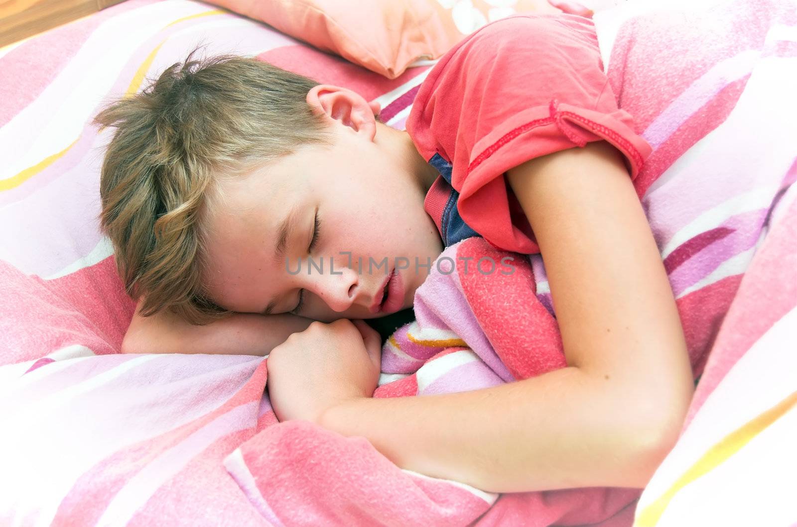 Sleeping boy in bed