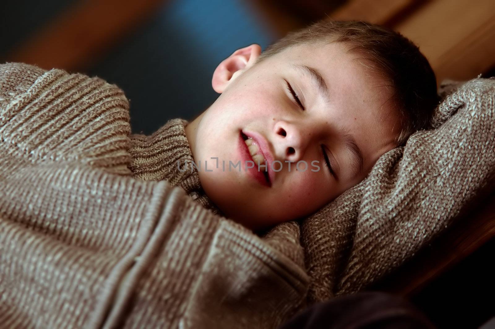 Sleepy boy. Tired falls asleep on stairs