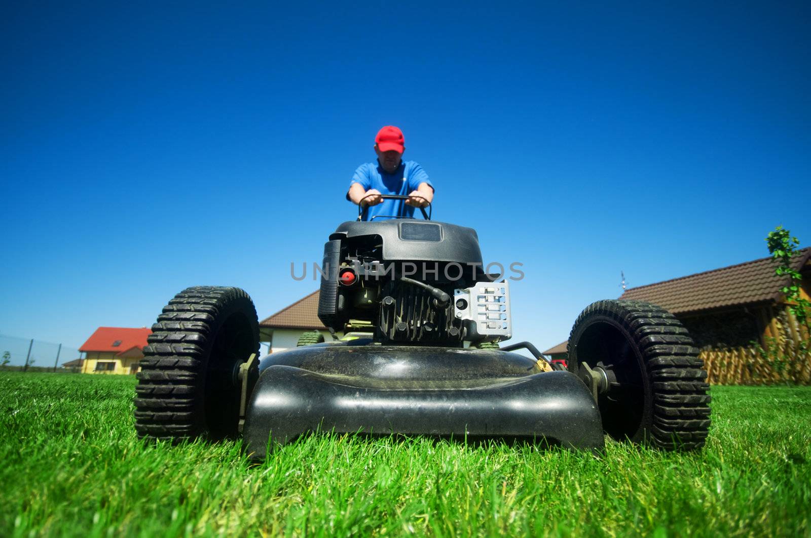 Man mowing the lawn. Gardening 