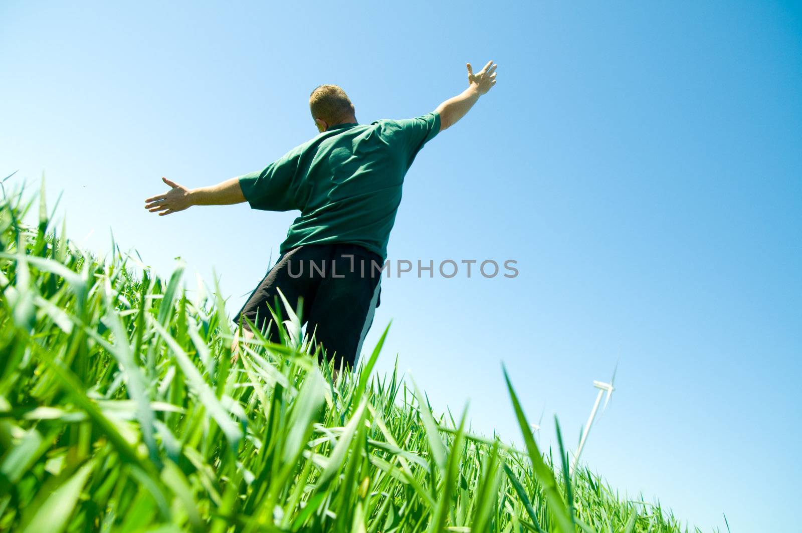 Happy man on the summer field by photocreo