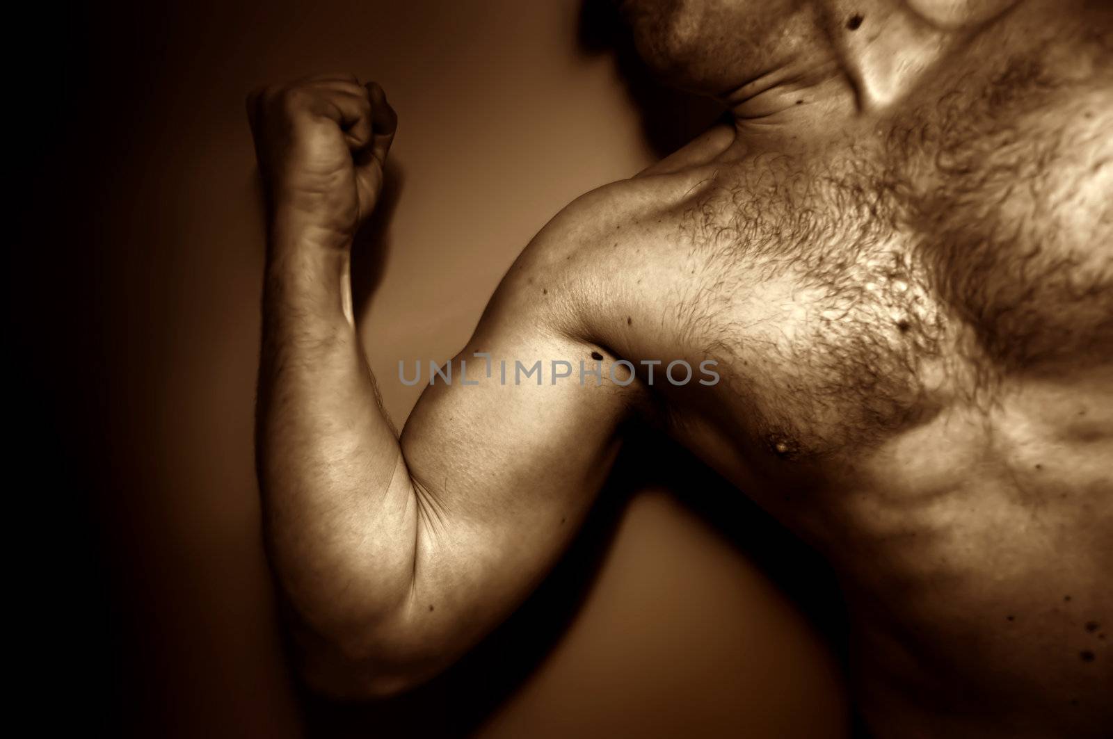 Strong adult male showing his muscles, expressing emotions