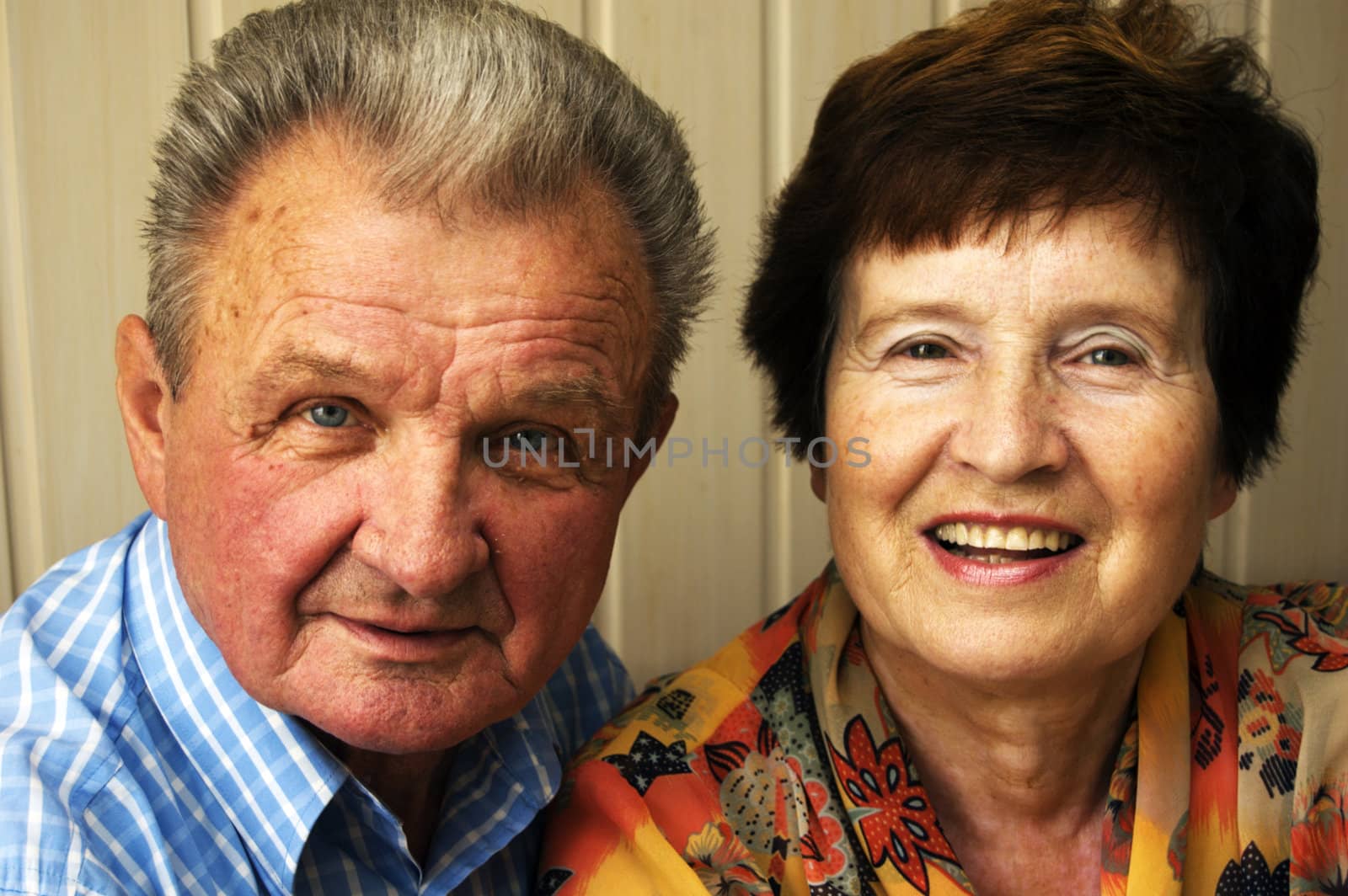 Happy senior couple isolated on white