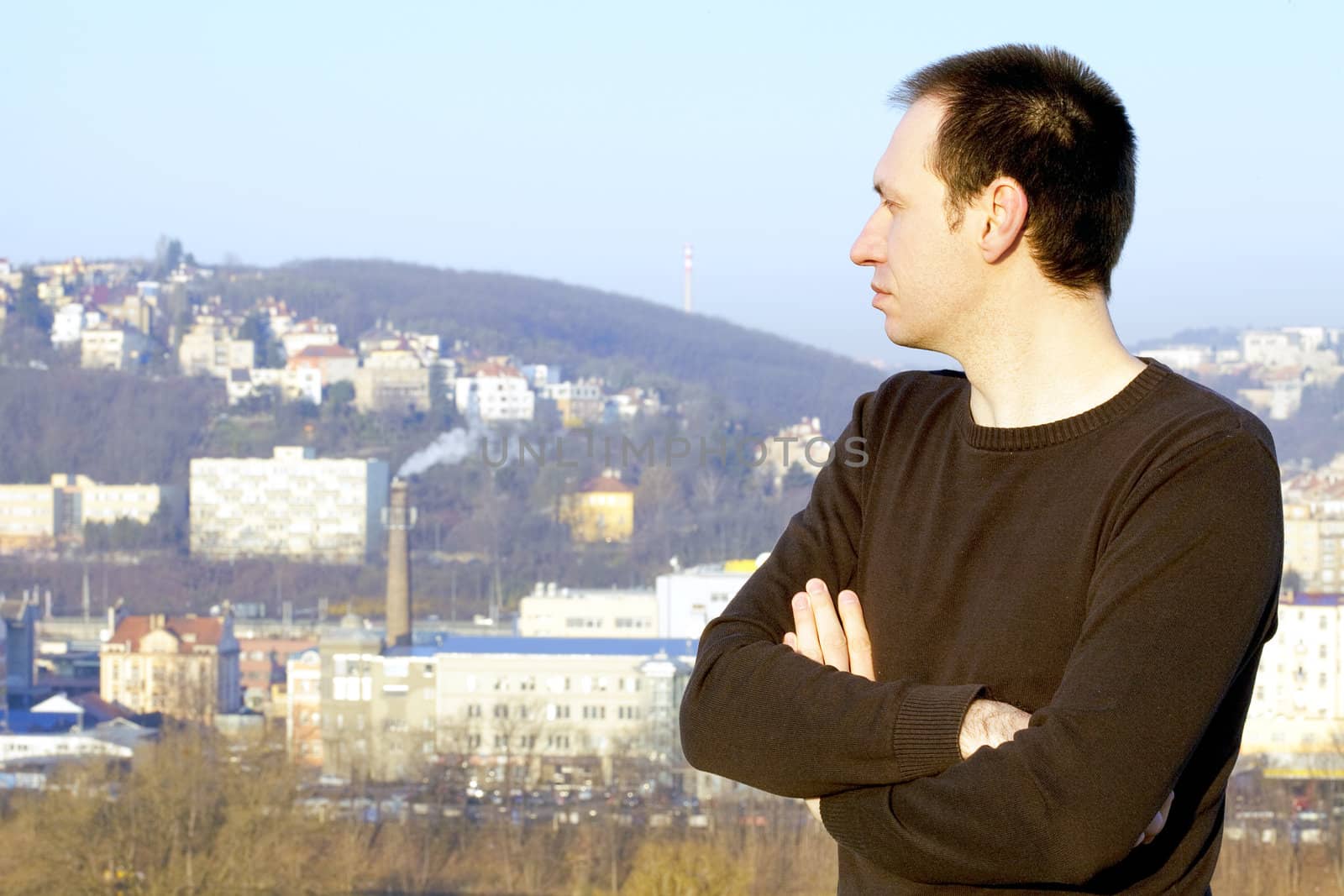 man standing against the city