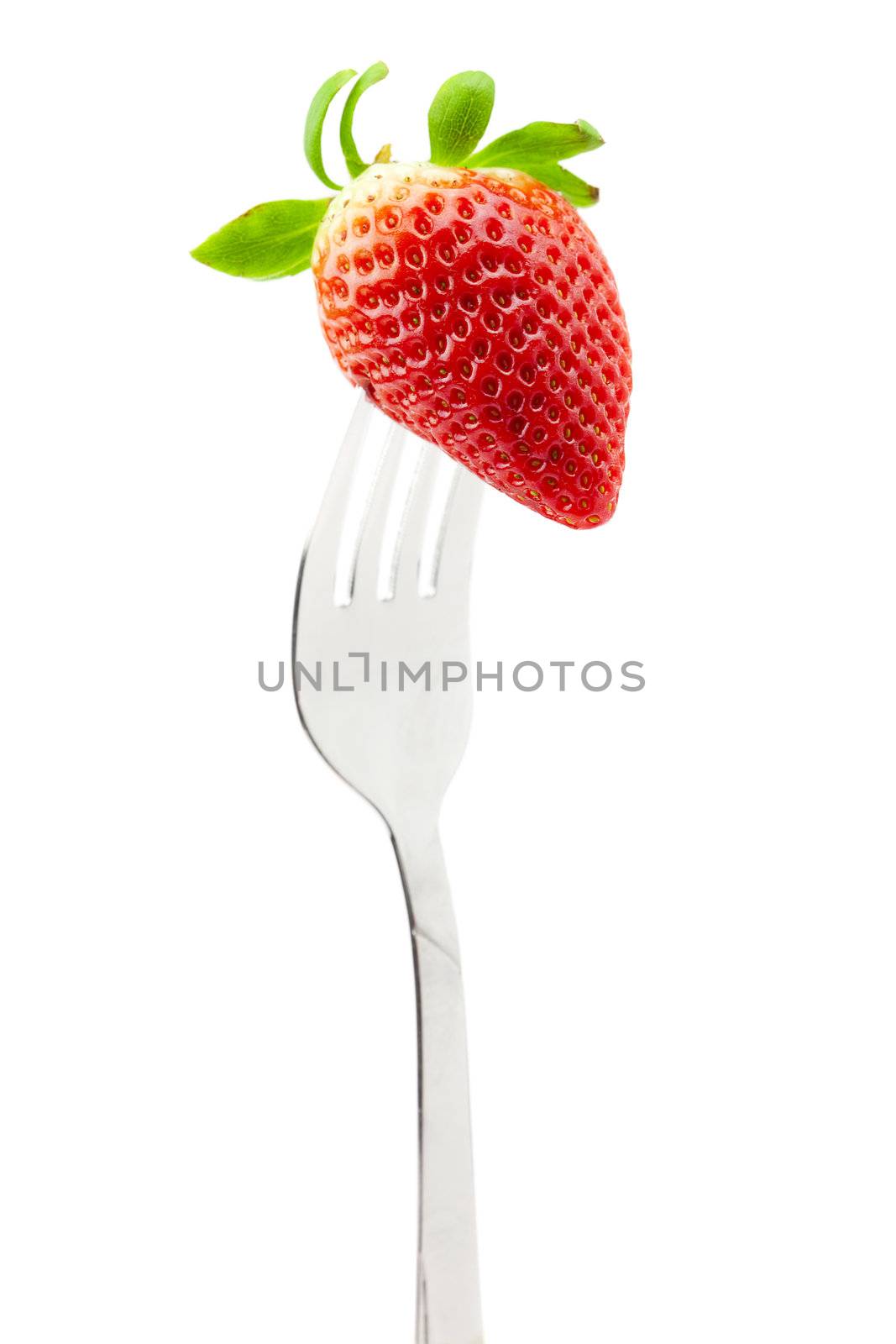 Strawberry on fork isolated on white by jannyjus