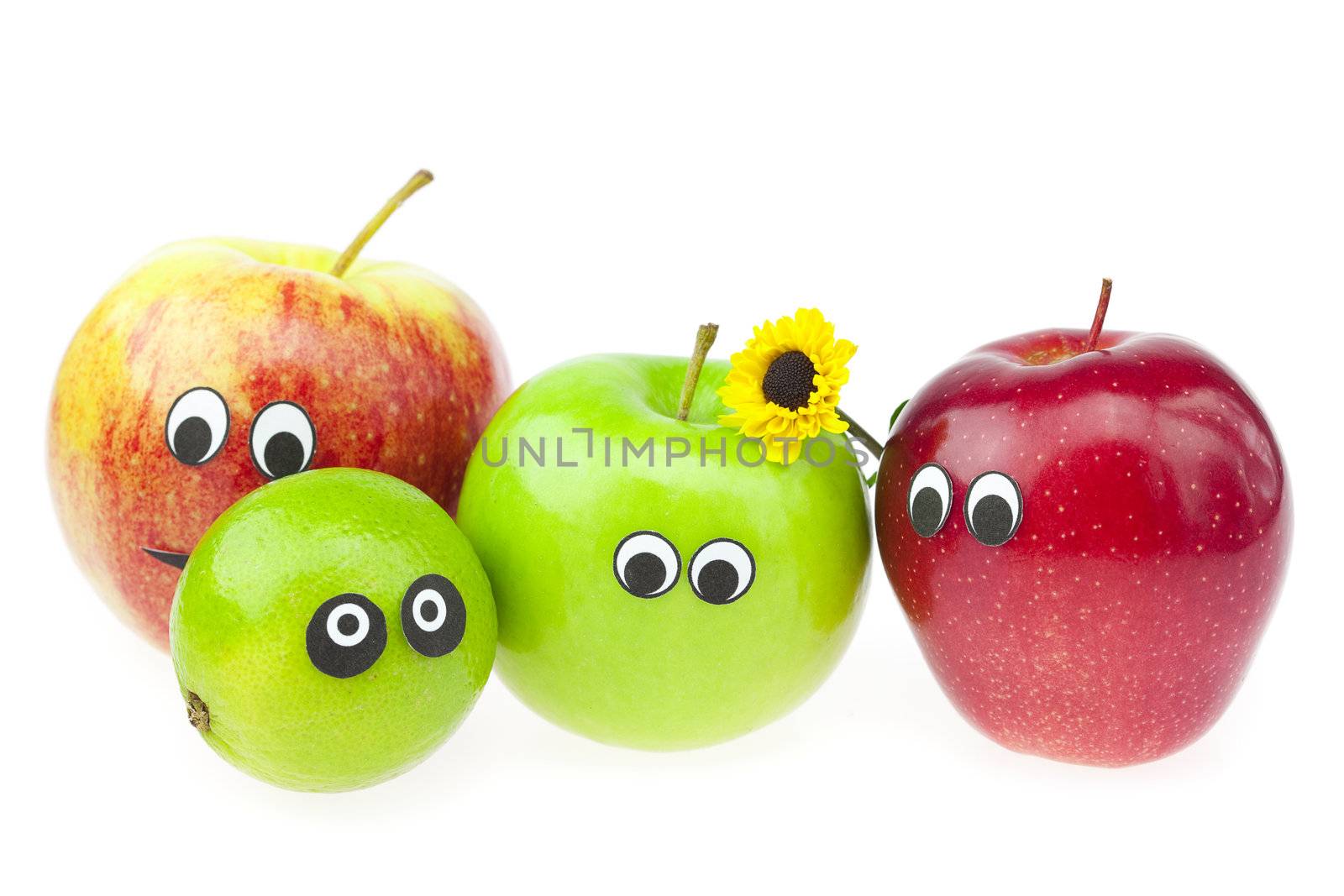 apple and lime with eyes isolated on white