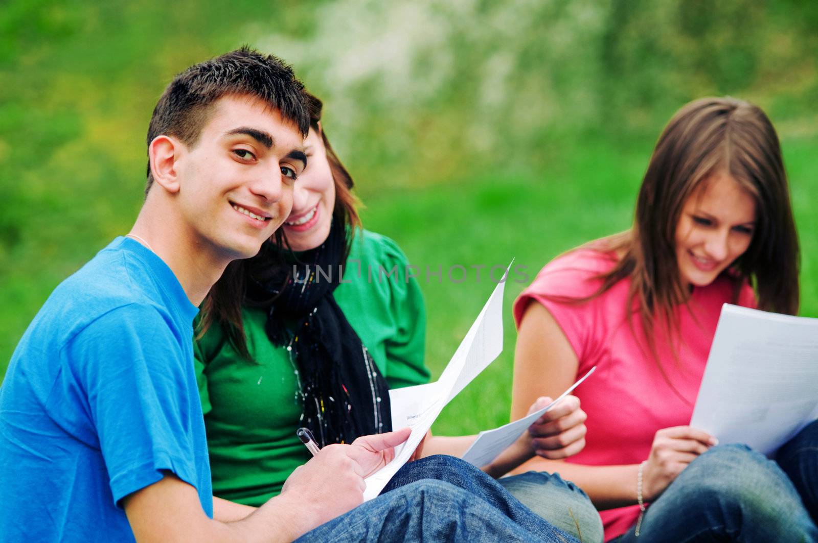 Highschool students learning together outdoor