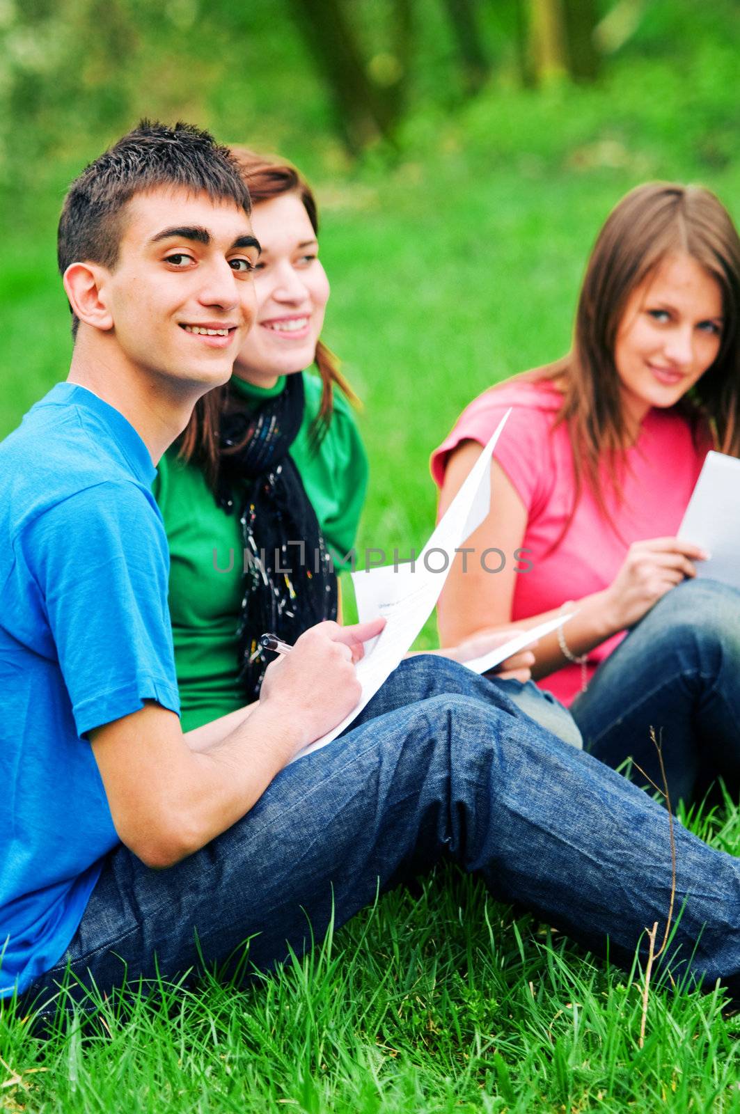 Highschool students learning together outdoor