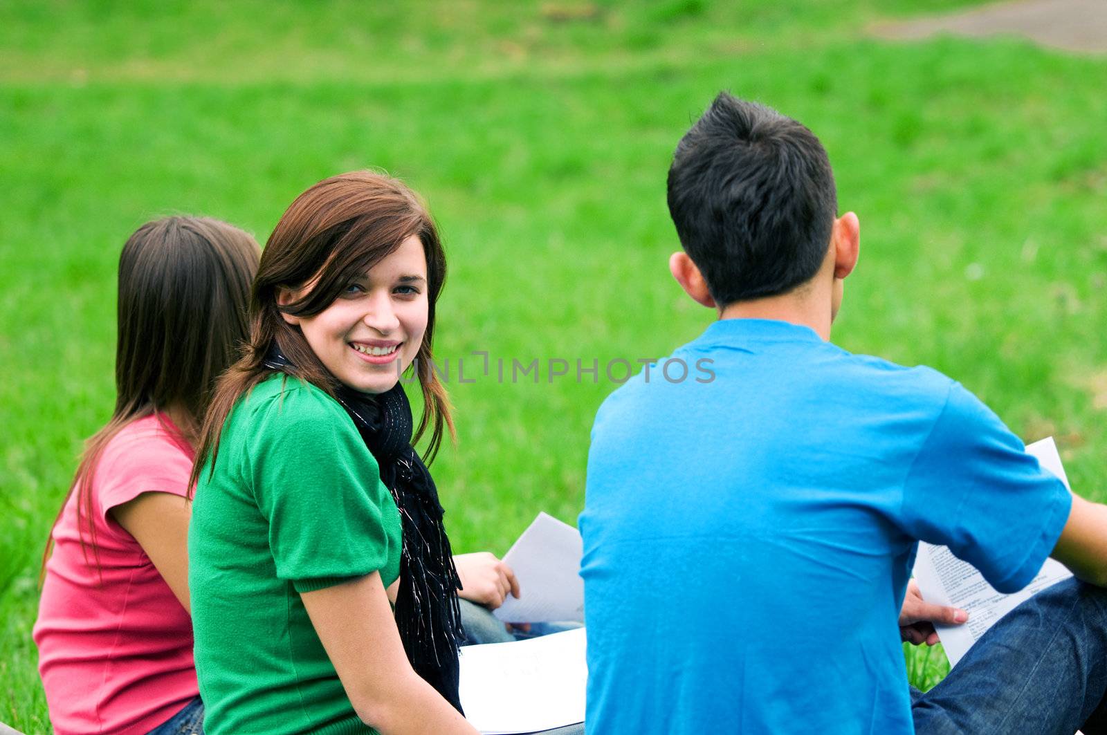 Highschool students learning together outdoor