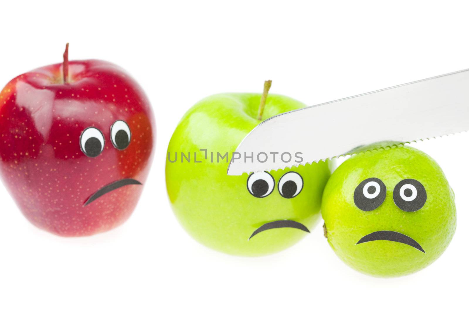 comic still life of apples and limes with eyes isolated on white