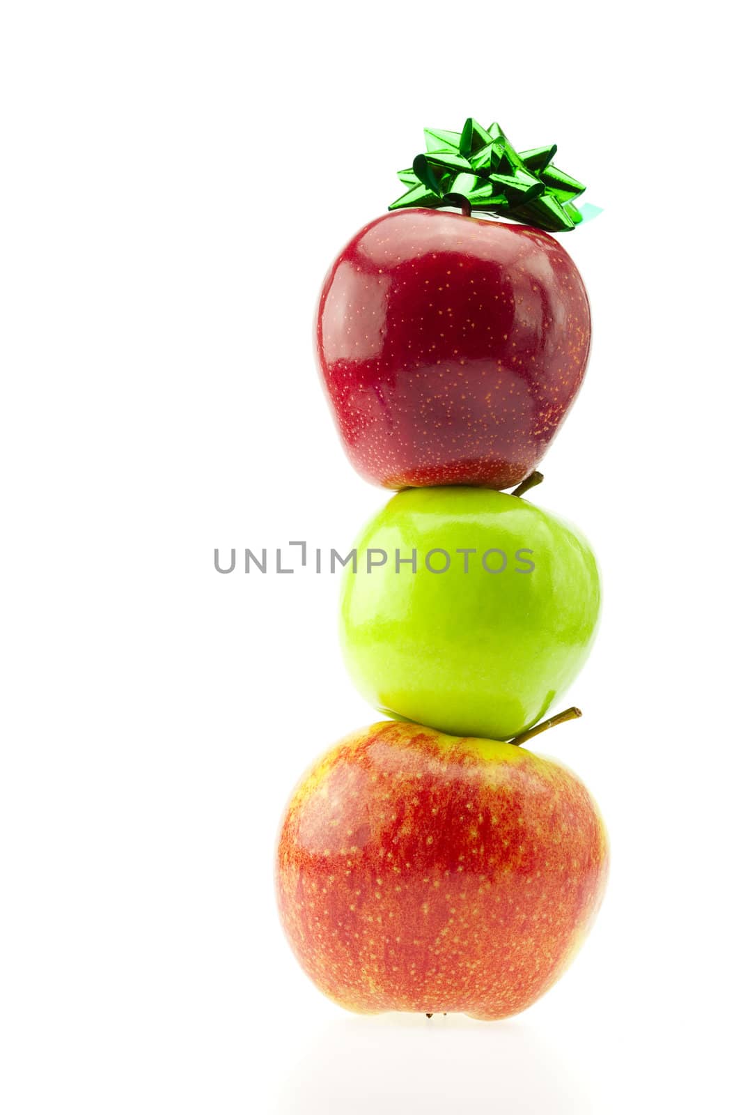 mountain of apples and ribbon isolated on white