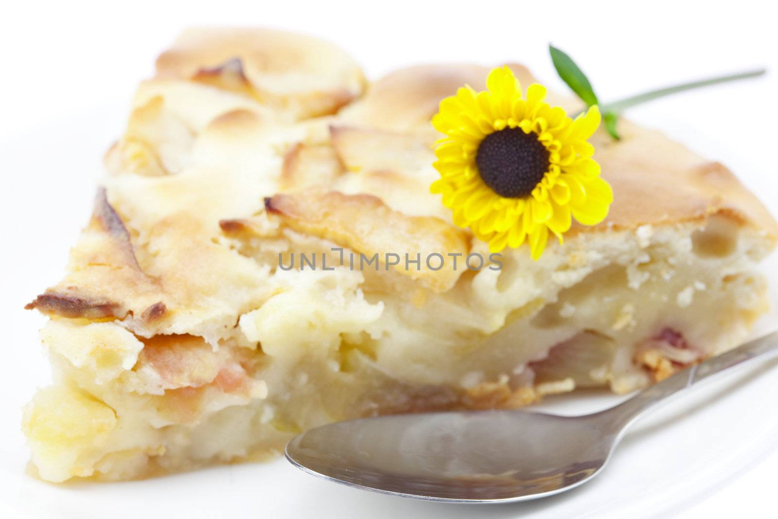 apple pie on a plate with a flower