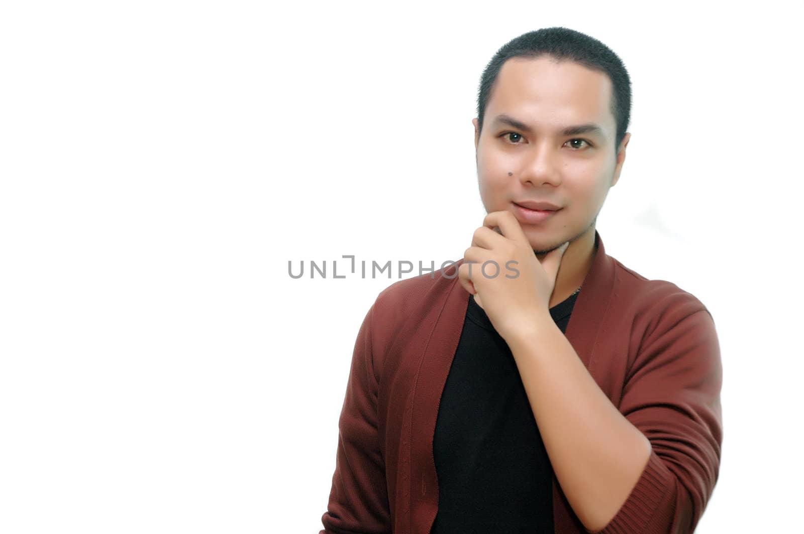 young man with a thoughtful gesture isolated on white background