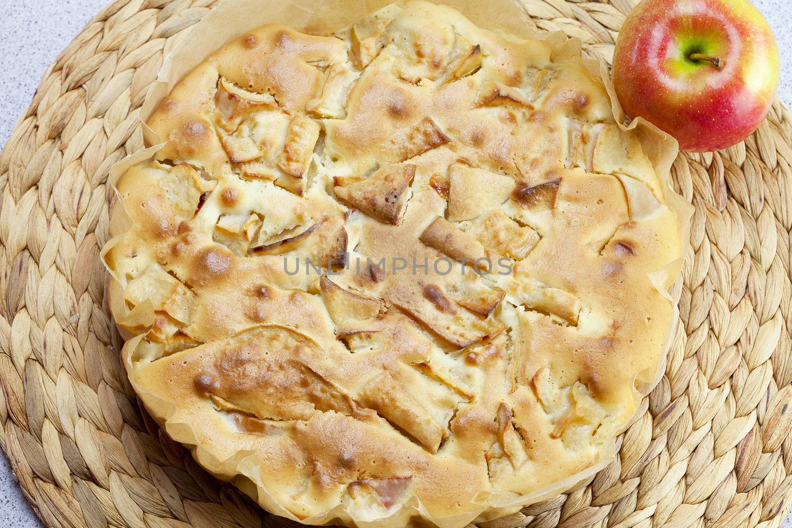 home apple pie and apple on a wicker mat