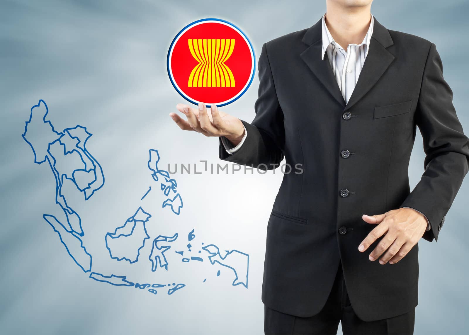 ASEAN Economic Community in businessman hand  by FrameAngel