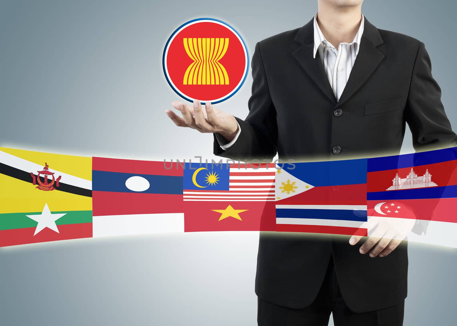 ASEAN Economic Community in businessman hand  by FrameAngel