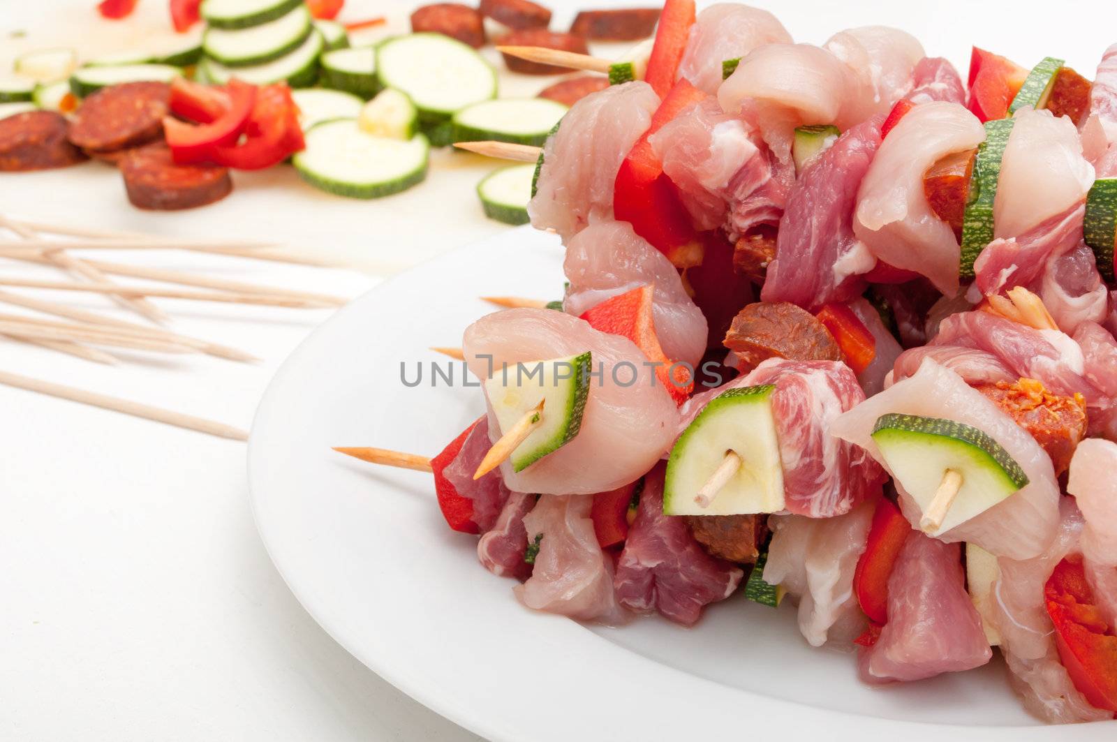 Shish kebab - Wooden Skewer With Chicken and Pork Meat, Sausage, Pepper, Zucchini