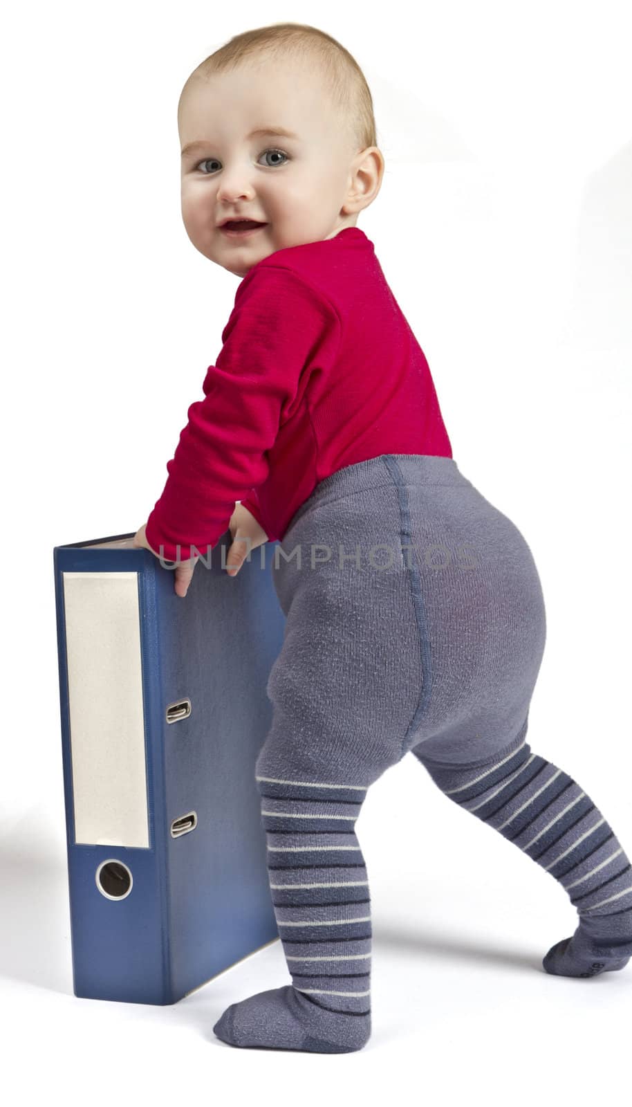 small child standing next to blue ring binder by gewoldi