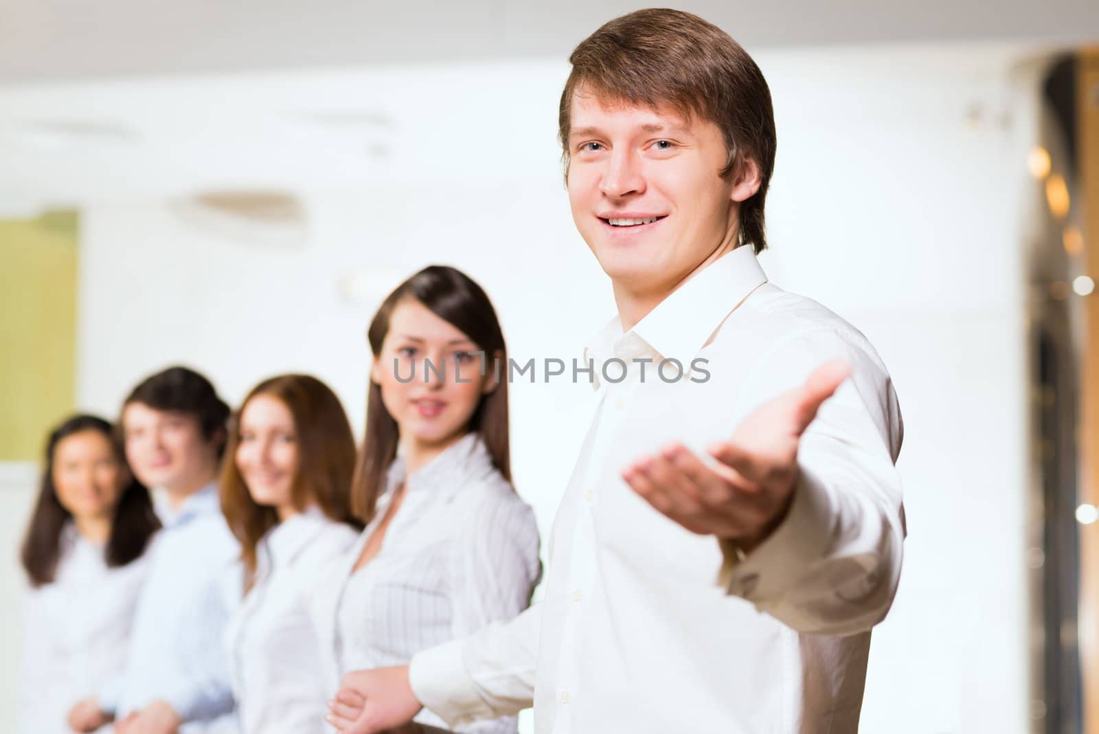 group of people holding hands, man holds out his hand, the concept of teamwork