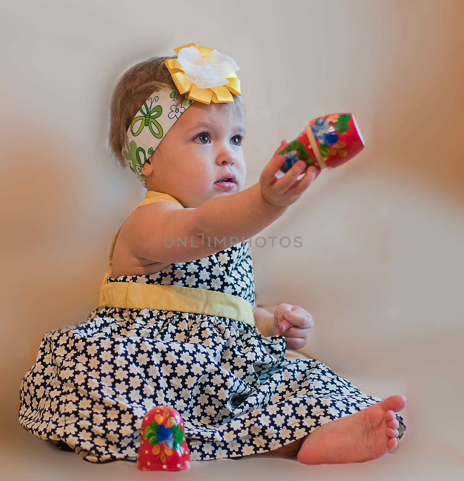 Little girl with matrioshka in her hand