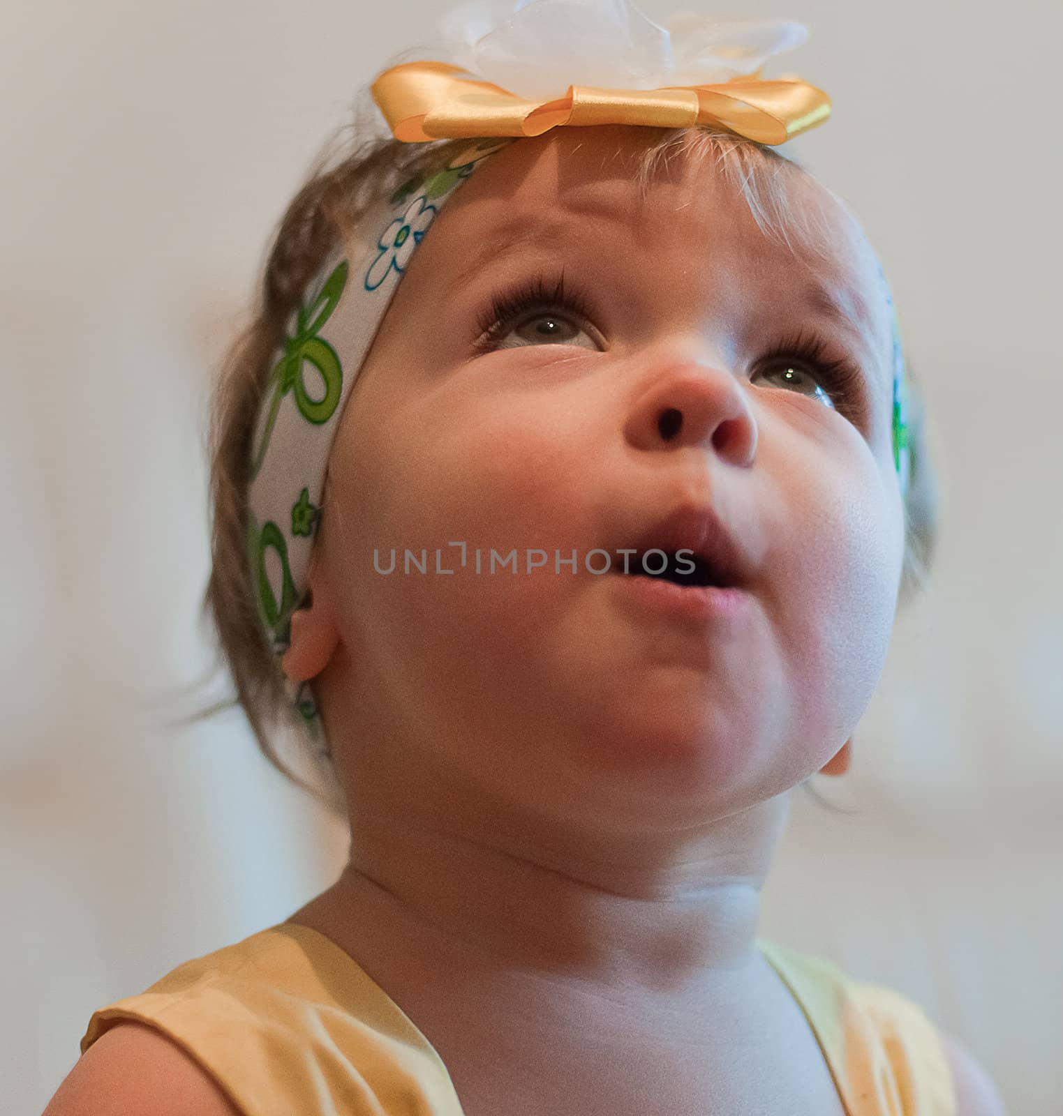 Little surprised girl looks up by Linaga