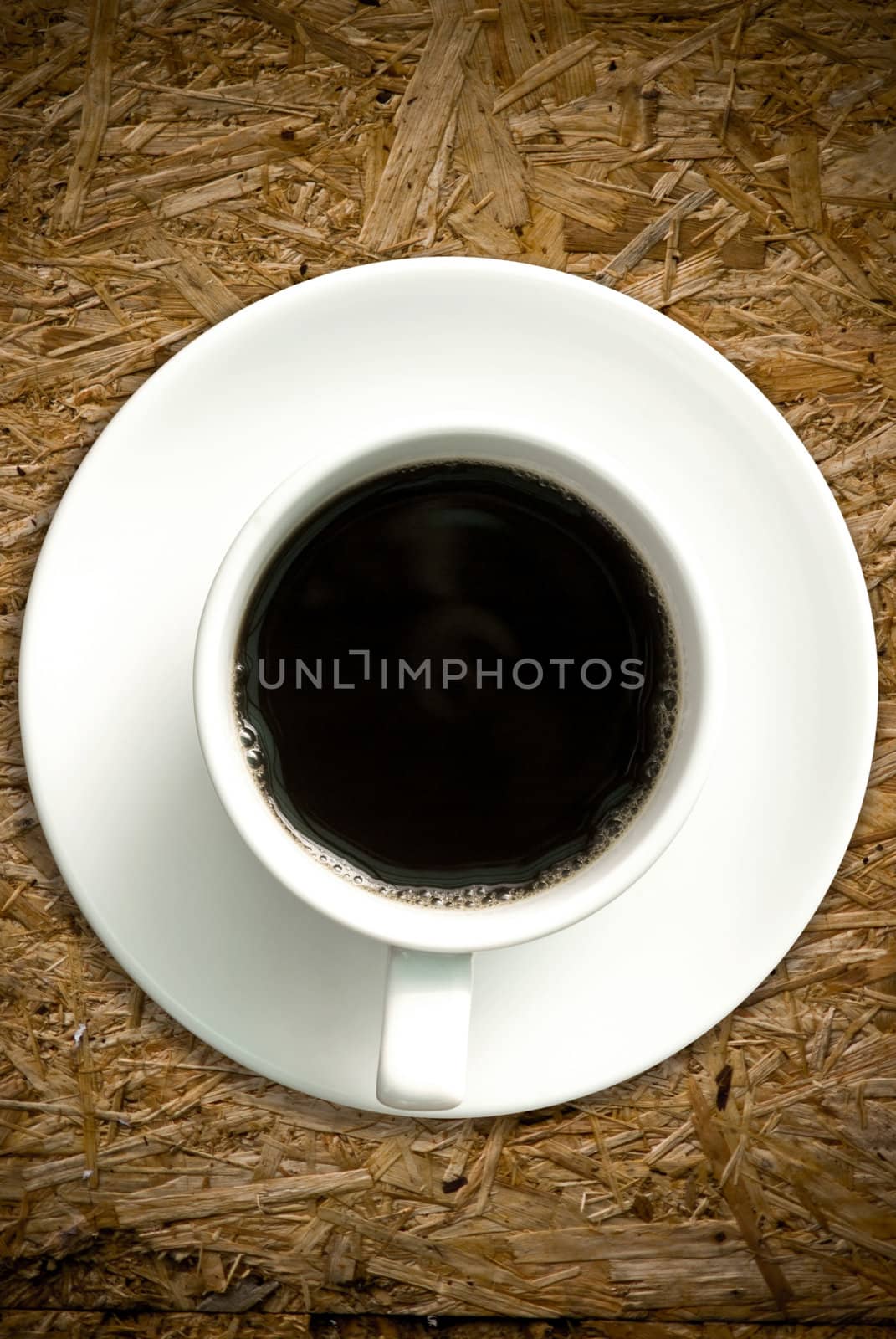 Coffee cup on grunge wood table by pixbox77