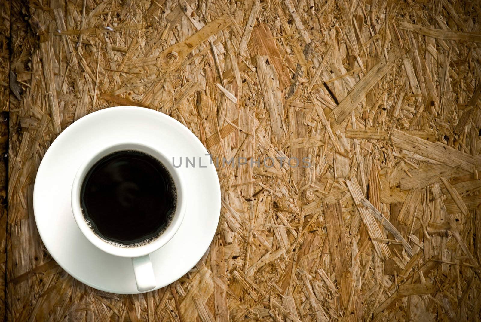 Coffee cup on grunge wood table by pixbox77