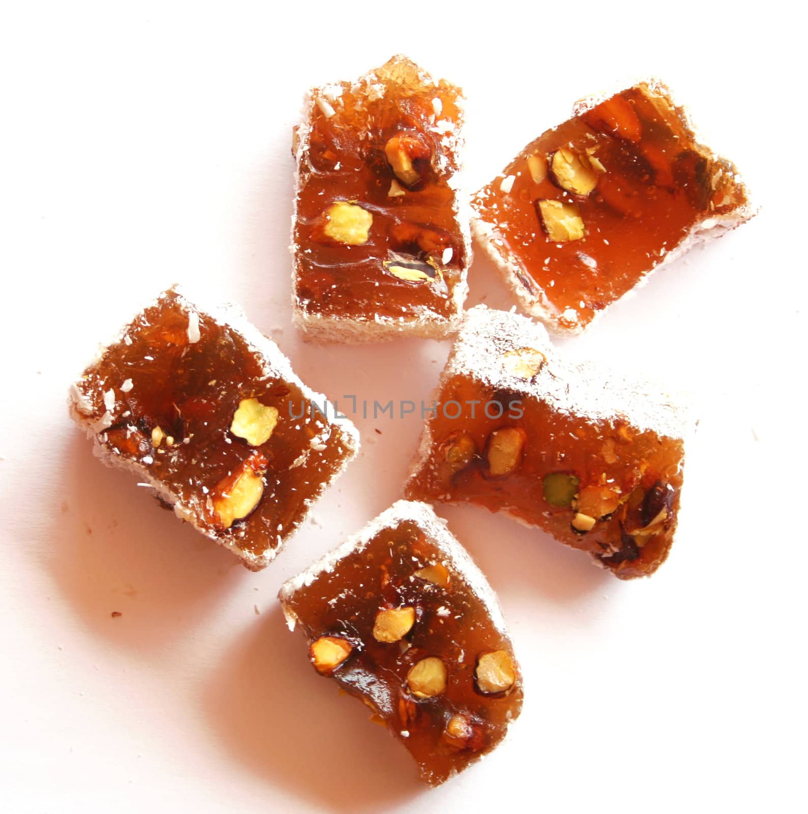 Sweet turkish delights with nuts on white background 