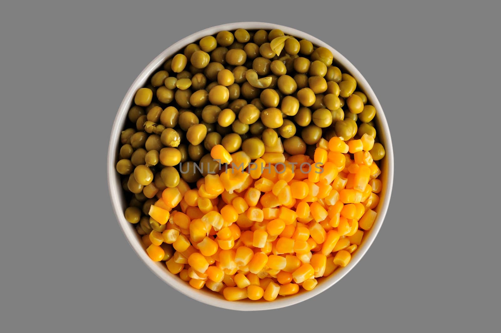 a plate with corn and peas, isolated, on a grey background