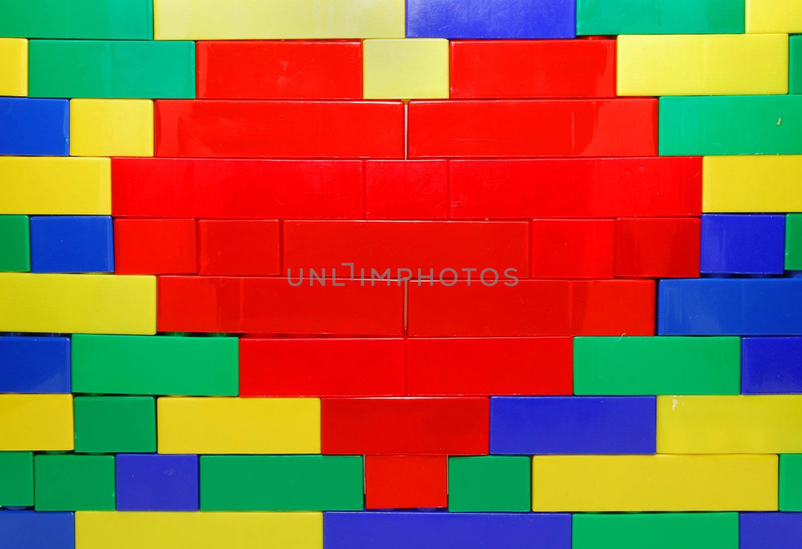 Red Heart Shape of Lego Blocks on the Lego Wall