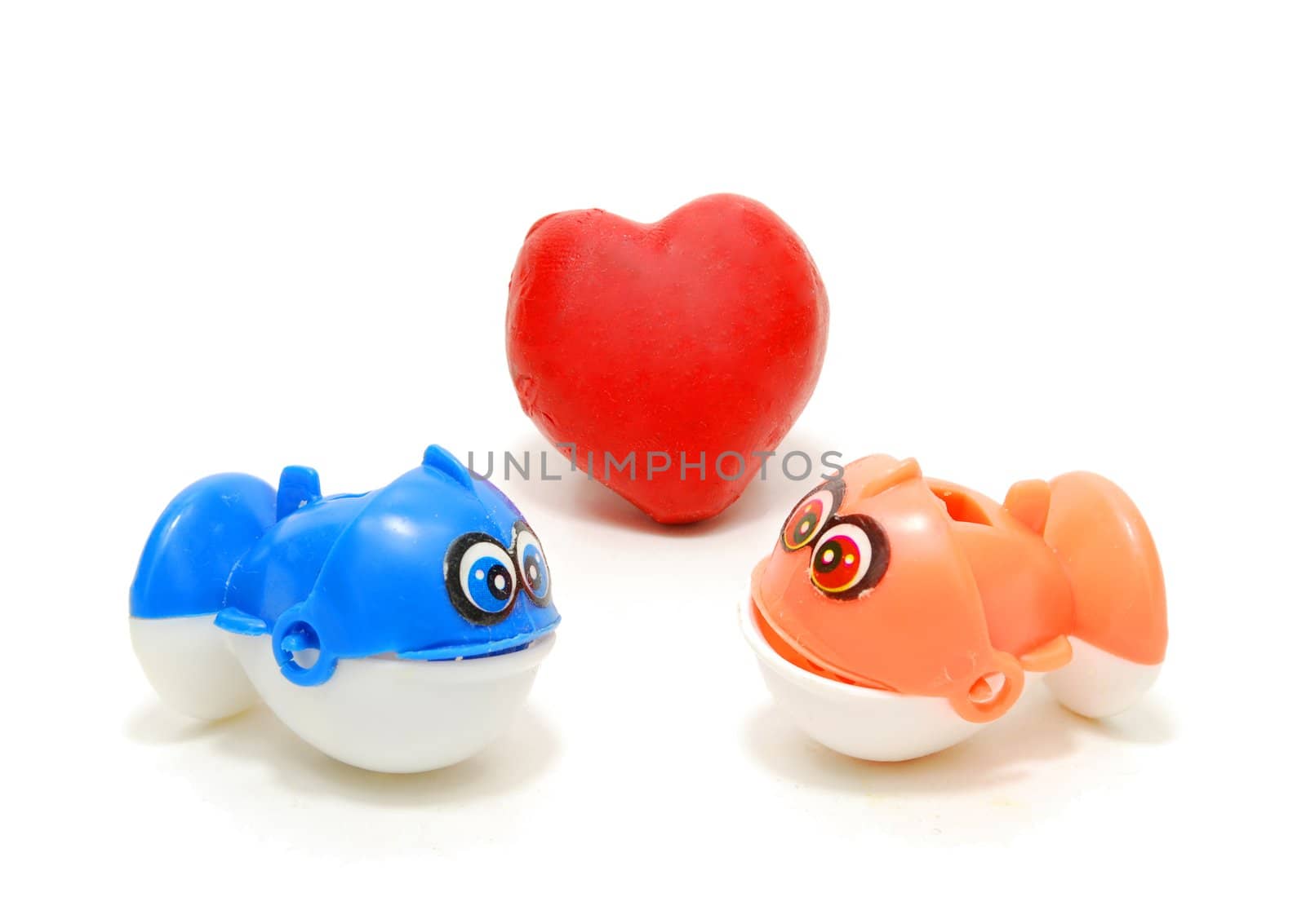 Two Toy Fishes with Read Heart as Love Sign Isolated on White