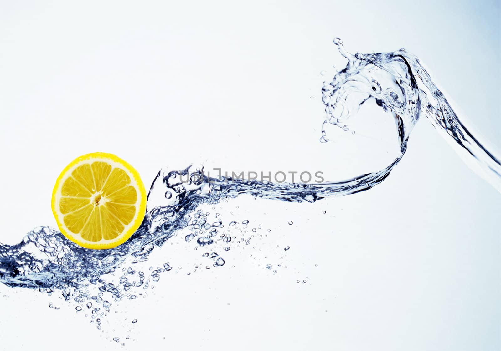 lemon in spray of water