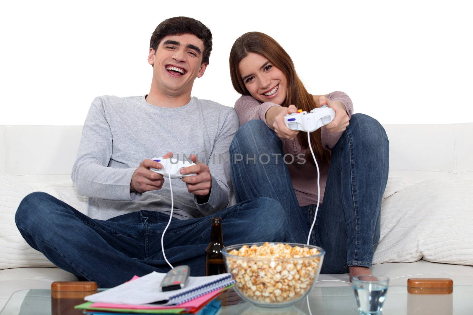 Couple playing to video games by phovoir