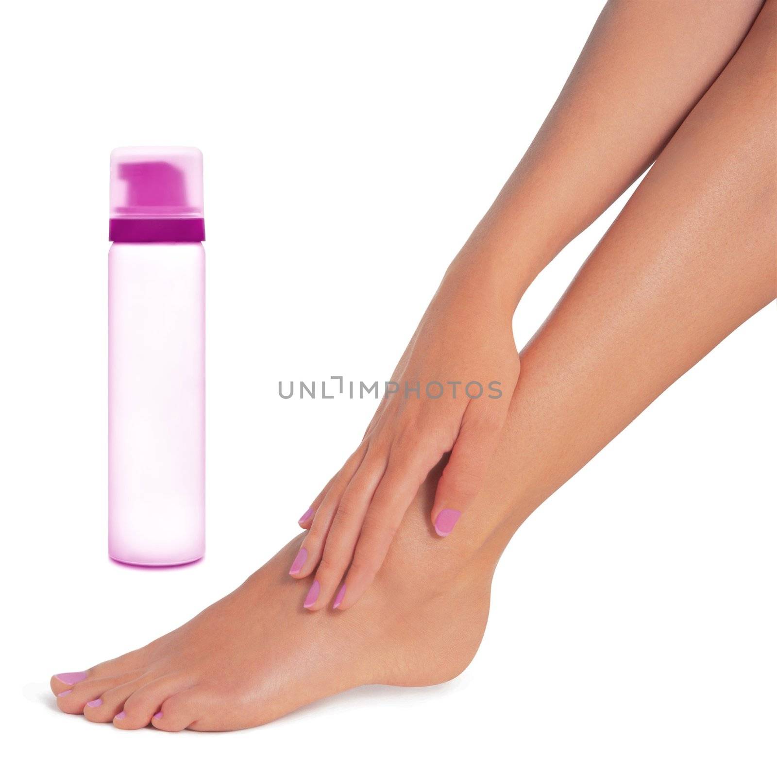 Cream on the beautiful legs on a white background