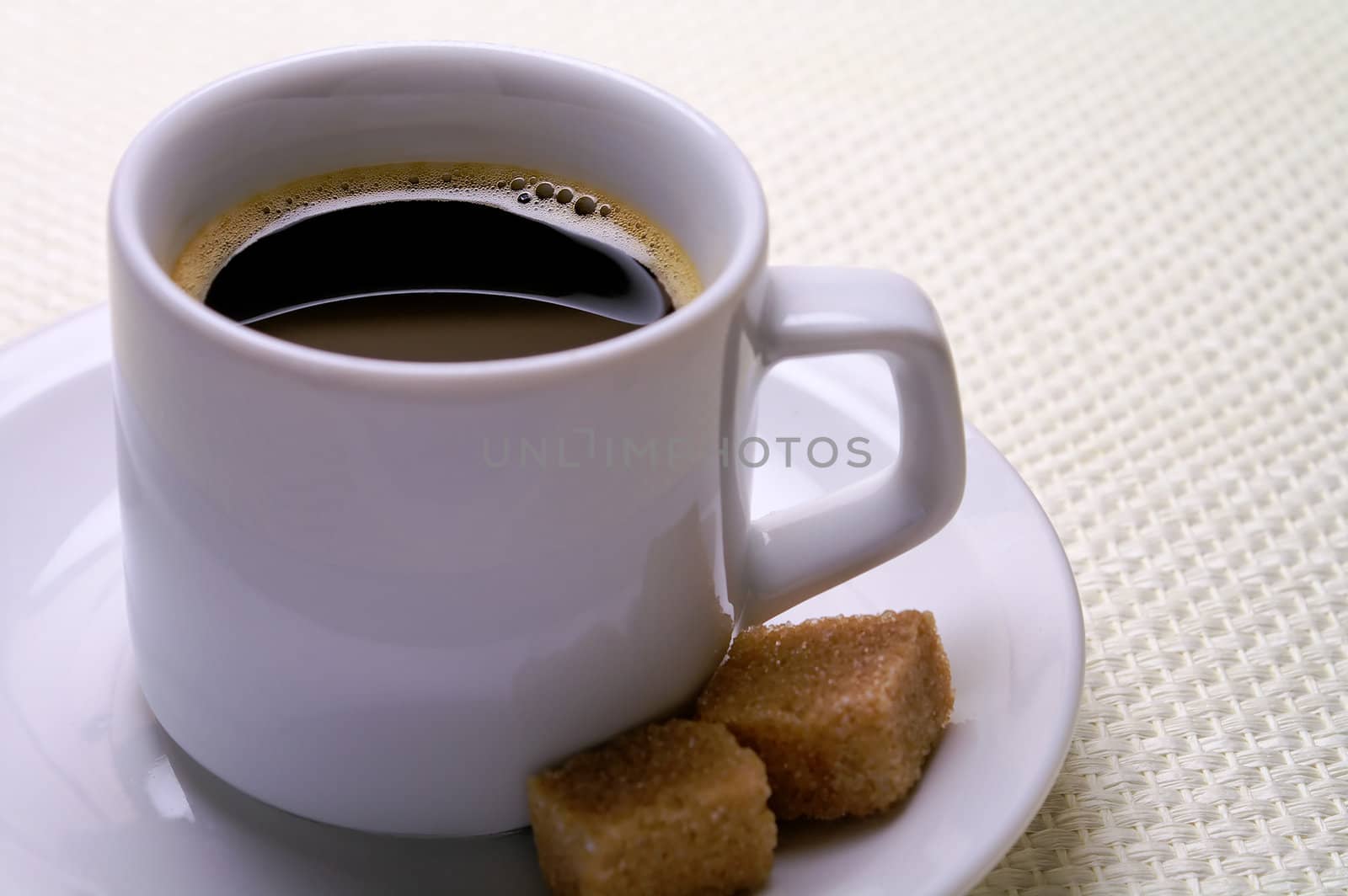 Coffee cup with sugar cubes