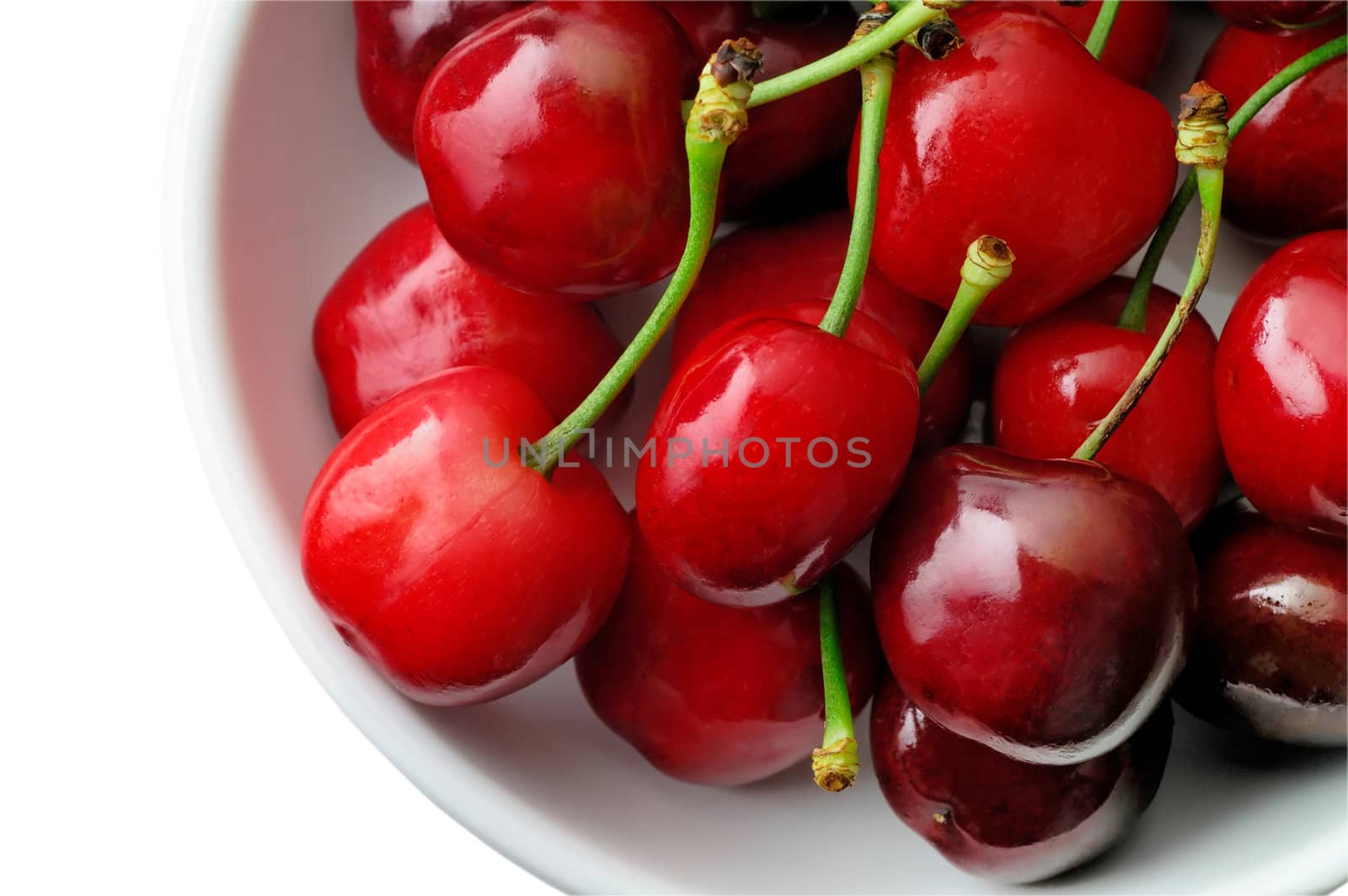 Fresh cherries with stalk in a bowl (from top) with clipping path by Laborer